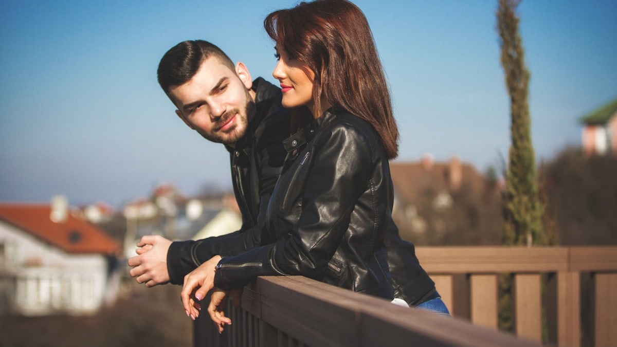 Man looking at women, both smiling.